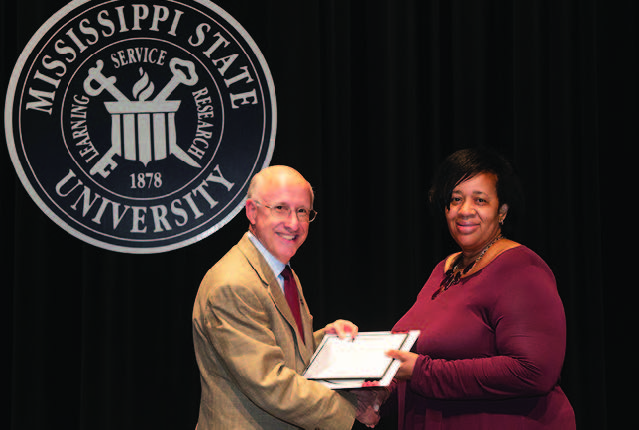 David Shaw, vice president for research and economic development, congratulates Alice Chandler