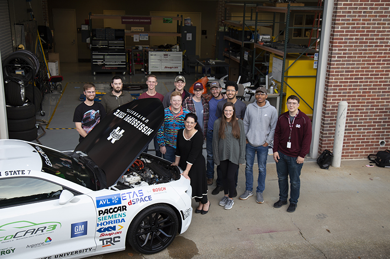 CAVS group photo with car