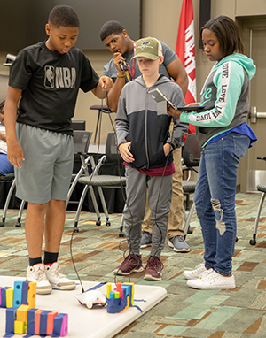 Operating robot at Robotics Camp