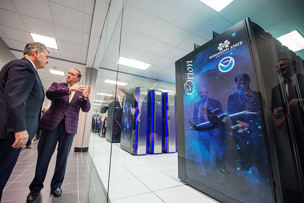 MSU and NOAA officials celebrate the ribbon-cutting for the Orion supercomputer at MSU
