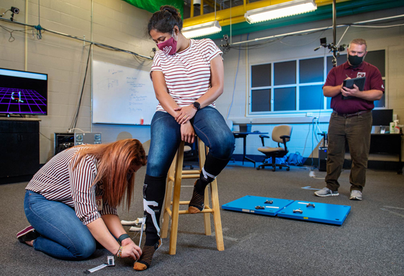Burch oversees students working with wearable sensors
