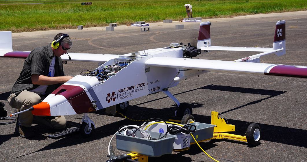Newburn makes a payload adjustment on a TigerShark XP