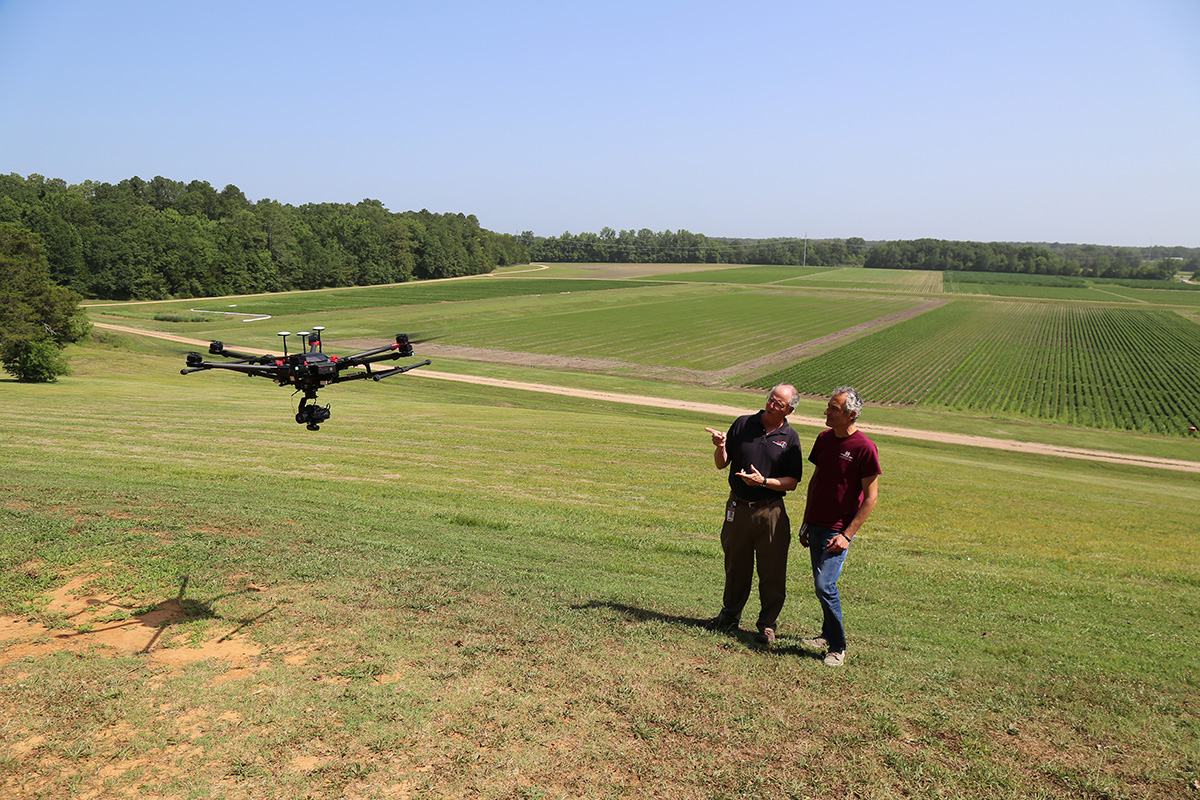 a visiting scholar from Italy are conducting research on how farmers can use data collected by drones to improve crops