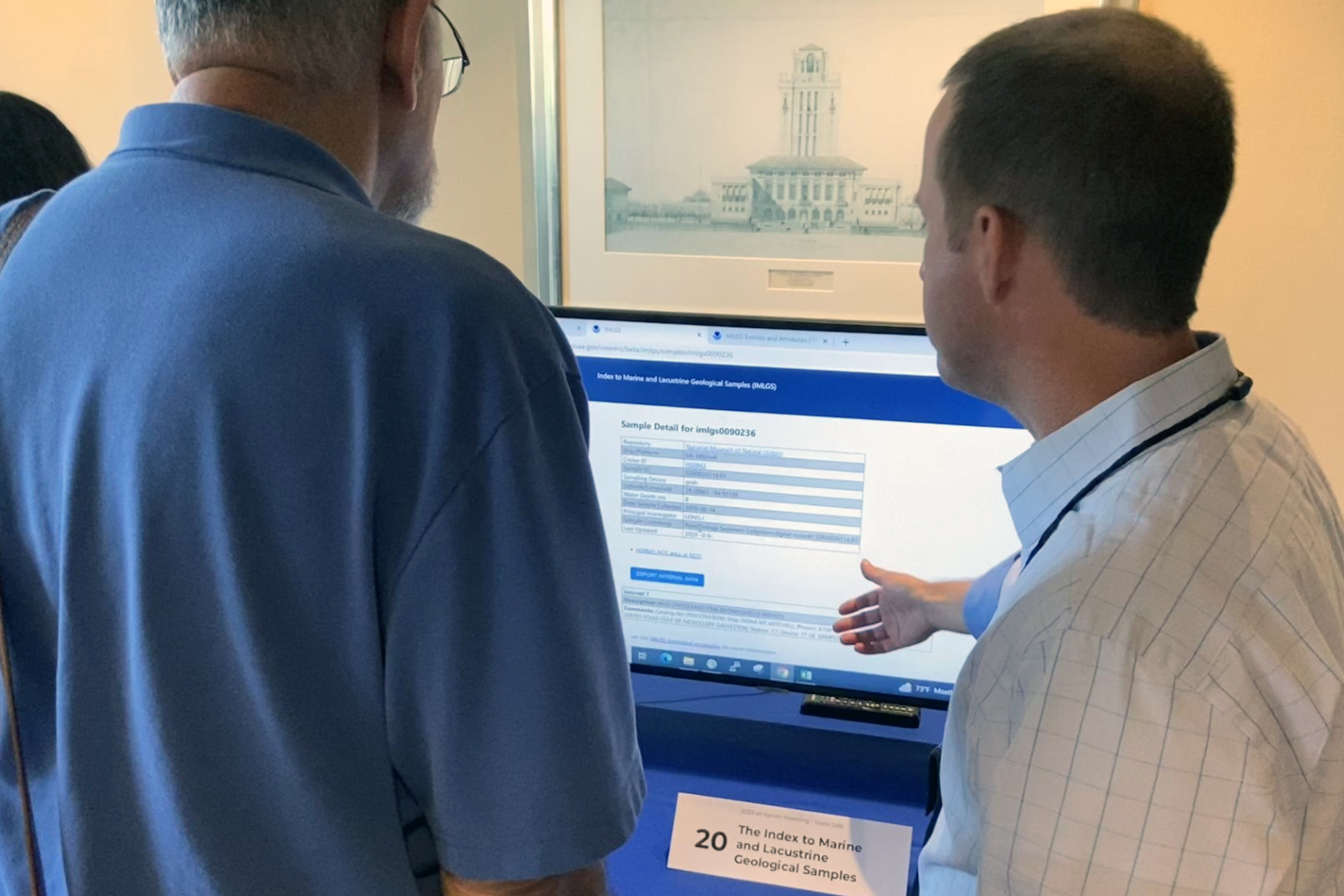 During the Tools Cafe, Clint Edrington with NGI (R) demonstrates the NCEI Index to Marine and Lacustrine Geological Samples (IMLGS), a web-accessible map viewer and database. 