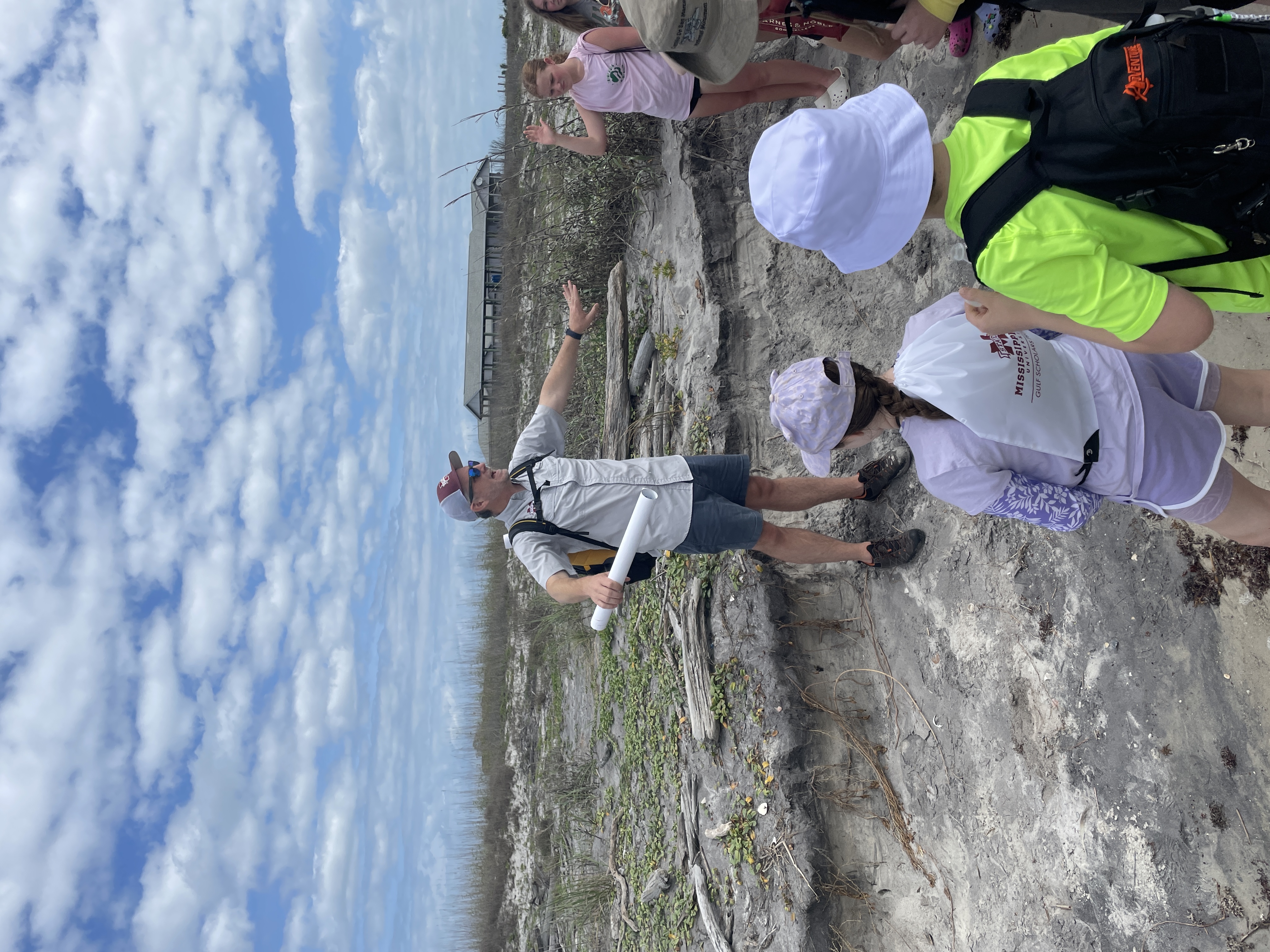 Man directing children